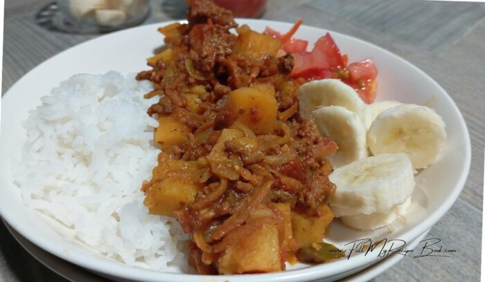 Place the lid on the pan and allow to simmer for a while until the carrots and the potato cubes are tender and cooked, and this should take about 20 minutes.
Serve with rice and chopped tomatoes and bananas to combat the flavors of the curry.