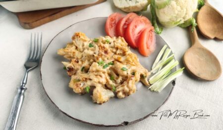 Homemade creamy cauliflower mac and cheese with cheese sauce. An oven baked spicy cheesy, low-carb comfort food for dinner.
