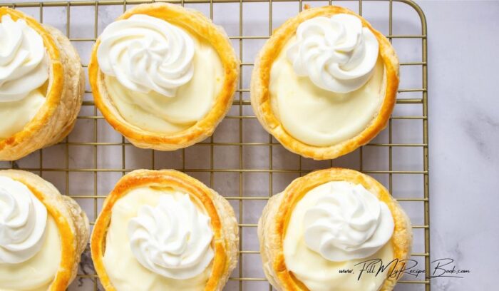 Let cool completely. If the center puffs up too much, press it down gently with a spoon once cooled. Whisk the pudding mix with 1 cup cold milk until smooth and thickened. Fold in the whipped cream for a lighter, mousse-like texture. Chill until ready to use.