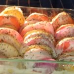 A creamy, crispy roasted potato bake made with sweet and regular potatoes, onions, and tomatoes. A comforting family side dish for any meal.