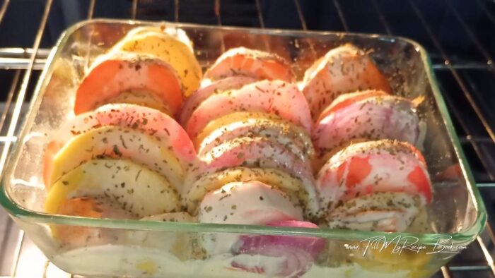 Place a sheet of foil over the top of the dish, and place in the oven to bake. (photo not foiled as it was the last half of the baking)
Keep the foil over the potatoes for half of the baking time. Then for the last 15-20 minutes remove the foil and leave to bake finish. (even turn them at this point so they larger potatoes get covered in the cream). The potatoes should be tender and the cream will be absorbed.
Should take 35-45 minutes to bake, as this will depend on your oven you using. As well as the size of the dish. But check with sharp knife if the potatoes are tender and crispy.
