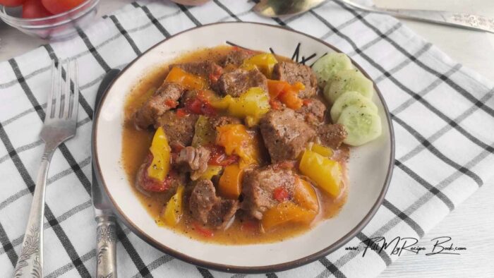 Tender beef, bell peppers, and onions simmered in a savory sauce. A crock pot pepper steak meal that is an effortless dinner recipe. Perfect for busy nights.