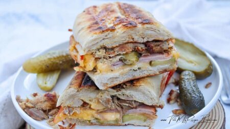 A delicious Easy Cubin Sandwich Recipe for lunch. Filled with ham, roast pork pieces, cheese, mustard, and dill pickles. Grilled in 6 minutes.