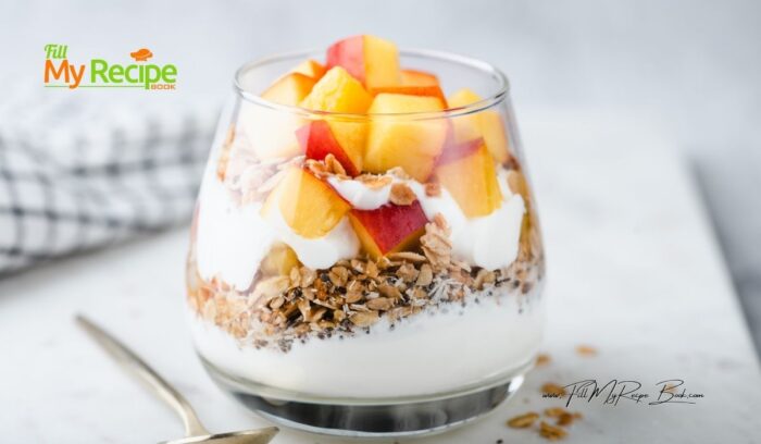 In a glass add half of your plain full cream Greek yogurt to the bottom of the glass.
Mix your granola or muesli with your flax seed, place on the yogurt.
Place a few chopped up peaches on top.
Add the rest of the yogurt to the top of the granola.
Then sprinkle some granola or muesli on top of that.
To complete the parfait add you chopped up fresh peaches