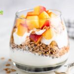 Healthy Peach Yogurt Parfait Recipe with granola, flax seeds, and fresh peaches, that are perfect for a quick, protein packed breakfast.