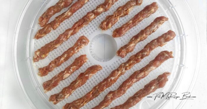 Dry the salami on two racks at 130°F for about 8 hours. Take a break for 2 hours. Switch the baking sheets and continue drying for another 7 hours.
