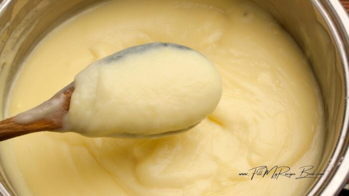 Prepare the custard sauce by following the instructions on the custard powder packet. Normally it is heating up the milk in a pot on the stove top. Keeping some milk to make a paste with the powder required and adding some sugar. Stir this paste to smooth consistency.