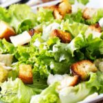 Zesty Caesar Salad with Crunchy Garlic Croutons and a creamy homemade dressing. A fresh, flavorful salad perfect for lunch or gatherings.