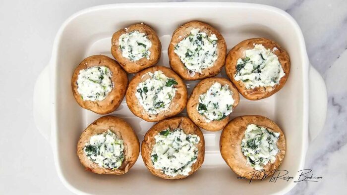 Mix the ricotta spinach and parmesan with the garlic in a small bowl. (spinach does not need to be cooked. It will bake in the oven)
With a tablespoon or dessert spoon, fill the mushrooms up.