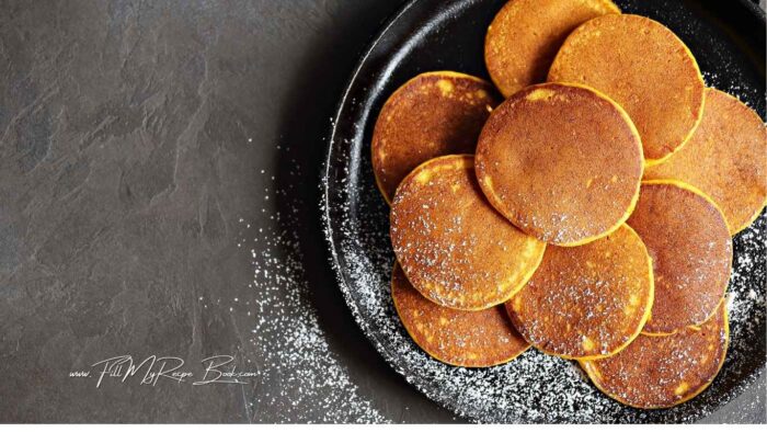 In a bowl whisk together the flour, baking powder, cinnamon and nutmeg, pumpkin spice.
Add the rest of the ingredients and stir until everything is just incorporated. Let the batter rest for 5 minutes.
Meanwhile heat a pan or griddle over medium heat. Grease with the olive oil or butter. Ladle around ¼ Cup pancake batter into the hot pan and cook for 1 ½ minutes or until small bubbles appear on top. With the help of a spatula flip the pancake and cook for 40 seconds more or until done.