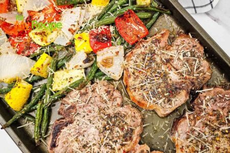 Try this Easy Sheet Pan Italian Pork Chops recipe with roasted vegetables for a quick weeknight meal. Fresh veggies, with Parmesan in one pan.