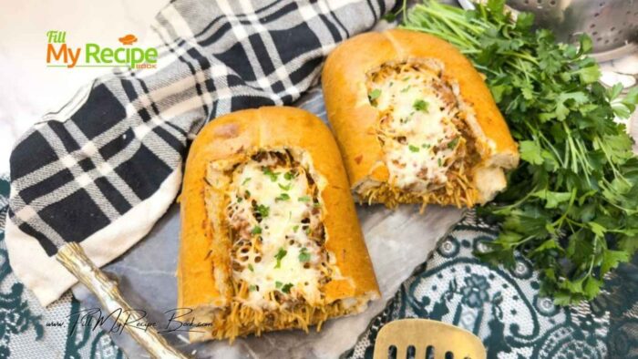 Easy Spaghetti Stuffed Garlic Bread recipe. Easy and quick oven bake or grill loaf filled with ground beef and pasta sauce, with cheese.