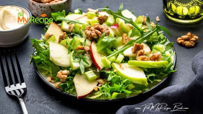 Healthy Waldorf Salad Recipe idea for lunch. Crunchy, freshness of crispy apples, lettuce, and celery topped with walnuts for a family.