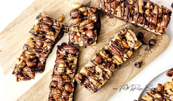 A chewy healthy chocolate Homemade Granola Nut Bars recipe. Easy and quick idea for oven baked snack or treat with honey, coconut oil, oats.