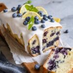 Easy moist lemon blueberry loaf cake with glaze recipe bursting with fresh berries and citrus flavor. Delicious homemade dessert.