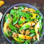 This Fresh Pear Arugula and Walnut Salad is light, crisp, and full of flavor. Sweet pears, peppery arugula, and crunchy walnuts come together for an easy, elegant side dish or starter.