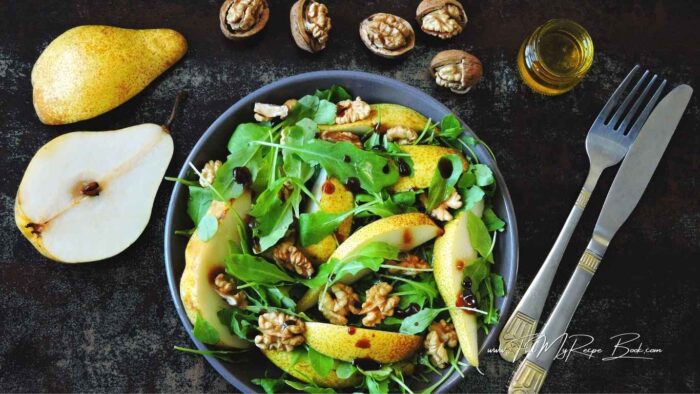 A light, crispy salad, full of flavor. Sweet ripe pears, peppery arugula, and crunchy walnuts come together for an easy, elegant side dish, with this delicious dressing.