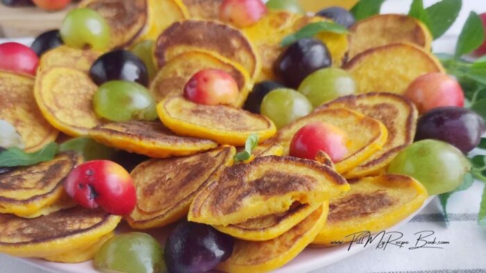 Heat the pan over medium heat, lightly grease with oil. Spoon the dough 1/2 tbsp. at a time, forming small pancakes. Fry for 2-3 minutes on each side until golden brown.