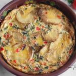 How to Make a classic Spanish tortilla with eggs, potato, onion, and bell pepper. A hearty potato omelet recipe perfect for any meal.