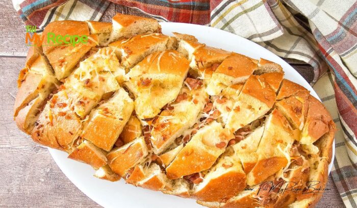 Savory Bacon Cheese Pull Apart Bread recipe. Simple appetizer or starter to bake with a ready made loaf of bread, using garlic and butter.