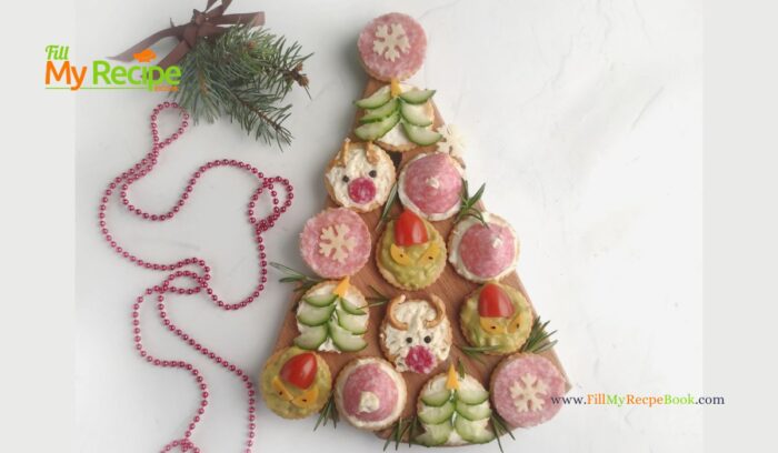Simple Christmas Cracker Appetizers recipe ideas for snacks and treats. Crackers garnished with cream cheese, salami, cucumber, cherry tomato.