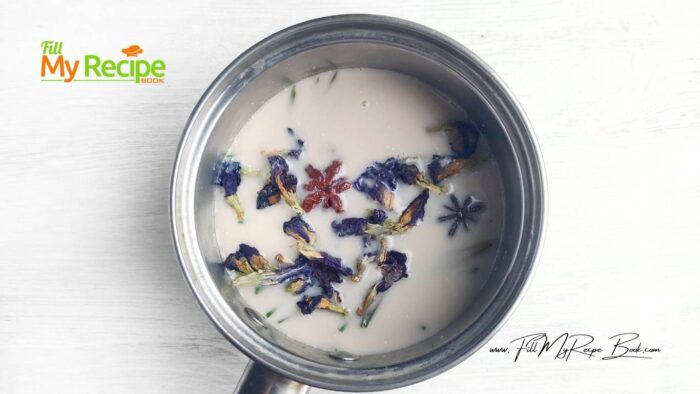 Place the pine cones, butterfly pea flowers, star anise and cinnamon in a saucepan.
Pour in the milk and simmer the drink on low heat. Do not boil. As soon as bubbles appear around the edge of the saucepan, cover the saucepan with a lid and turn off the heat. Let the drink steep for 7 minutes.