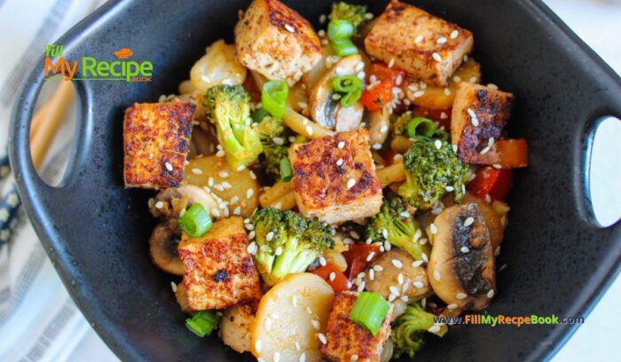 Easy Tofu Veggie Stir Fry Recipe idea with honey and sesame seeds. A no bake healthy vegan or vegetarian meal with udon noodles.