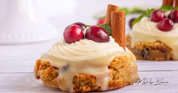 Whip up the cream cheese and butter and icing sugar, until nice and fluffy. Pip the frosting over the ganache and then decorate with cranberries and cinnamon stick and a sprig of mint leaf.
Another option is to add dried cranberries instead of fresh, or some crushed nuts of your choice. Blueberries or raspberries would make an attractive dessert decoration and be so appetizing. So many variations to choose from. Depends what's in your kitchen and the season you are in.