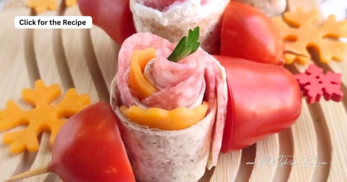 Make these festive Holiday Pinwheel Snack Skewers in just 10 minutes! Whole-wheat tortillas, salami, cheddar, and cream cheese for easy appetizers.