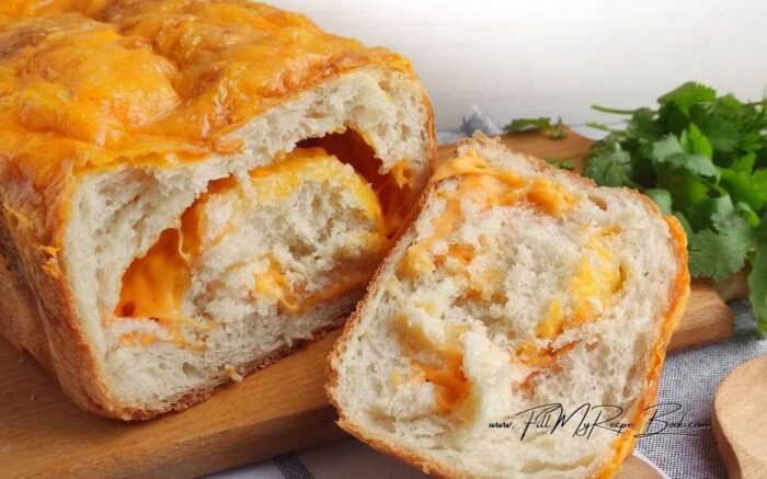 Bake the bread in the oven for 20 minutes. Reduce the temperature to 400 deg. F (200 deg. C) and bake for 20-25 minutes. Cool the bread in the pan for 7 minutes and remove it from the pan. Slice the bread after 5 minutes and serve.