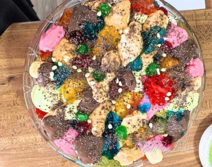 Add more jellies and desserts on top. Then garnish with chocolate sprinkles or small bits of chocolates, white chocolate chips. or Cherries.