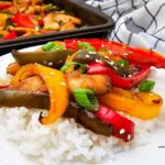 Family Favorite Teriyaki Chicken Sheet Pan Dinner with juicy chicken, colorful peppers, and a sweet savory glaze. A quick, an easy weeknight meal.