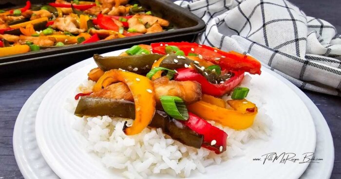 Family Favorite Teriyaki Chicken Sheet Pan Dinner with juicy chicken, colorful peppers, and a sweet savory glaze. A quick, an easy weeknight meal.