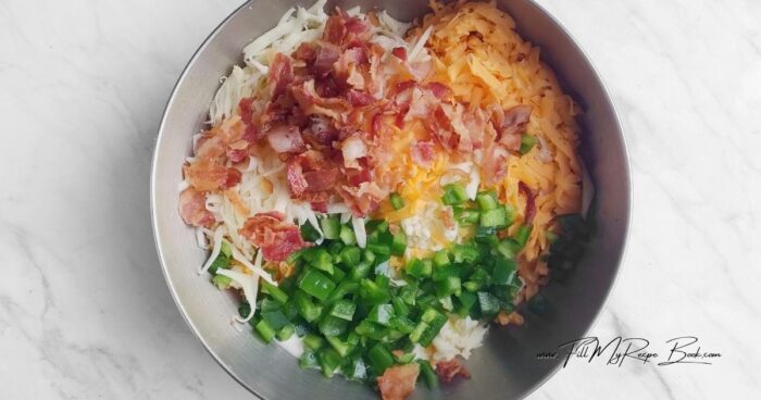 In a bowl, combine the cream cheese, mayonnaise, and sour cream. Season with salt, garlic, and pepper.