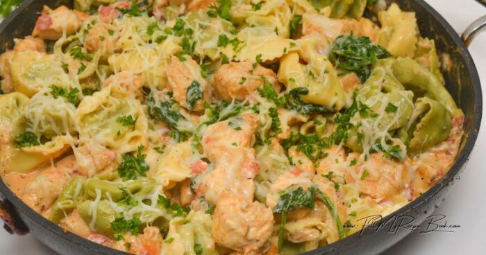 Season with salt and pepper to taste, and stir in the chicken and tortellini. Toss to coat well in the sauce.