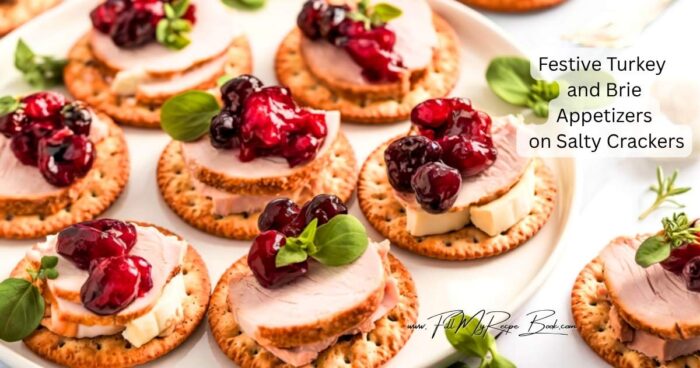 Preheat the oven to 175 deg. C ((350 deg. F) Only warming up the brie, other is so simple to assemble.
Arrange the Brie slices on a parchment-lined baking sheet and warm for 3–5 minutes, just until soft and creamy but not runny. This step brings out the Brie’s rich flavor and helps it blend beautifully with the other toppings.
Place crackers on a serving tray. Add a warm Brie slice to each cracker, followed by a small piece of turkey. (or the other way around if preferred)
Spoon a little cranberry sauce over each bite. Garnish with a tiny basil, or rosemary or thyme sprig if desired.