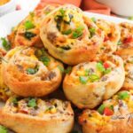 These Sausage Egg and Cheese Pinwheels are a quick, hearty breakfast idea with flaky pastry, savory sausage, and melted cheese in every bite.