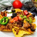 Loaded Sheet Pan Ground Beef Nachos made in minutes. Cheesy, flavorful, and perfect for game day or busy nights.