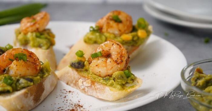 Top with the hot seasoned shrimp and some chopped green onion for garnish.