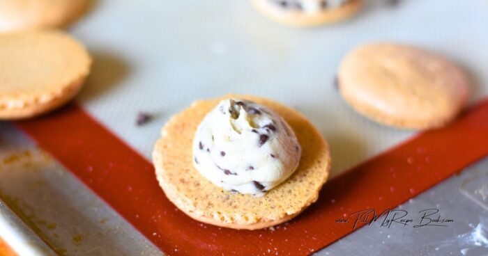 The filling is a rich buttercream enhanced with mini chocolate chips, adding a subtle crunch and extra sweetness that pairs beautifully with the tender shells. This combination creates a balanced dessert that isn’t overly sweet, making these macarons enjoyable for both special occasions and everyday treats.