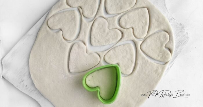 See the instructions in the recipe.
Roll out the dough to a thickness of 1/3-1/2 inch. Use a cookie cutter to cut out hearts.