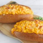 Elote style grilled hot dogs topped with creamy corn and melted cheese. A bold, easy recipe perfect for BBQs, parties, and summer gatherings.