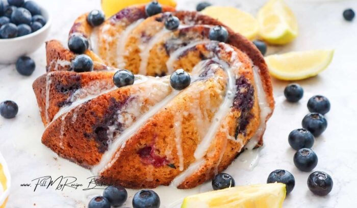 Glazed Lemon Blueberry Bundt Cake recipe with yogurt for a dessert. Easy homemade dessert that is moist and flavorful baked in 60 minutes.