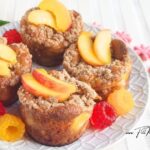 Easy Peach Cobbler Muffins Recipe made with fresh peaches, Greek yogurt, and a buttery cinnamon topping. Soft, moist, and perfect for breakfast.
