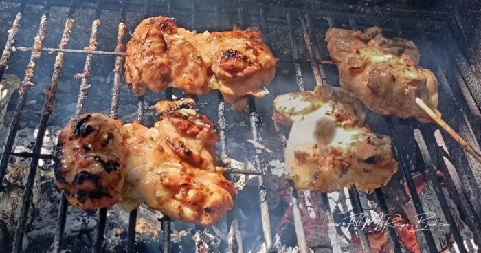 Place the chicken over the hot coals and cook for 5–6 minutes on the first side, or until beautifully caramelized with light grill marks. Turn the chicken over, baste with the remaining marinade, and grill for another 5–6 minutes, or until golden brown and cooked through.