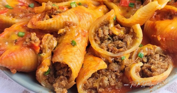 Easy Stovetop beef taco stuffed shells with jumbo pasta, seasoned ground beef, tomato sauce and Mexican-inspired flavors. A hearty family dinner.