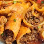 Easy stovetop beef taco stuffed shells with jumbo pasta, seasoned ground beef, tomato sauce and Mexican-inspired flavors. A hearty family dinner.